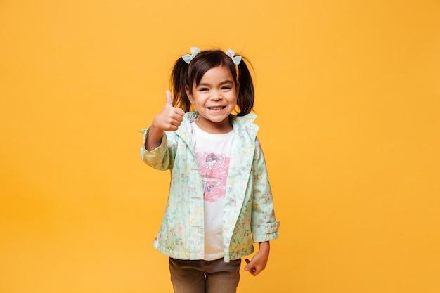 Happy little girl child standing isolated