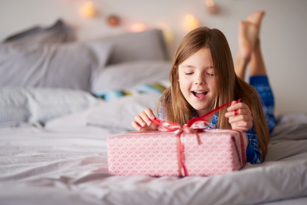 Happy little girl with Christmas present