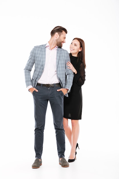 Happy loving couple standing isolated