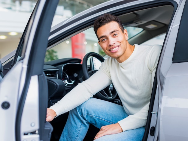 Happy man at dealership