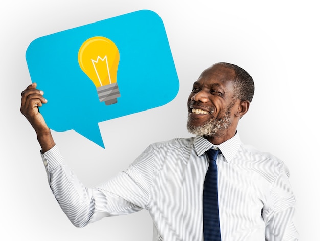 Happy man holding light bulb symbol