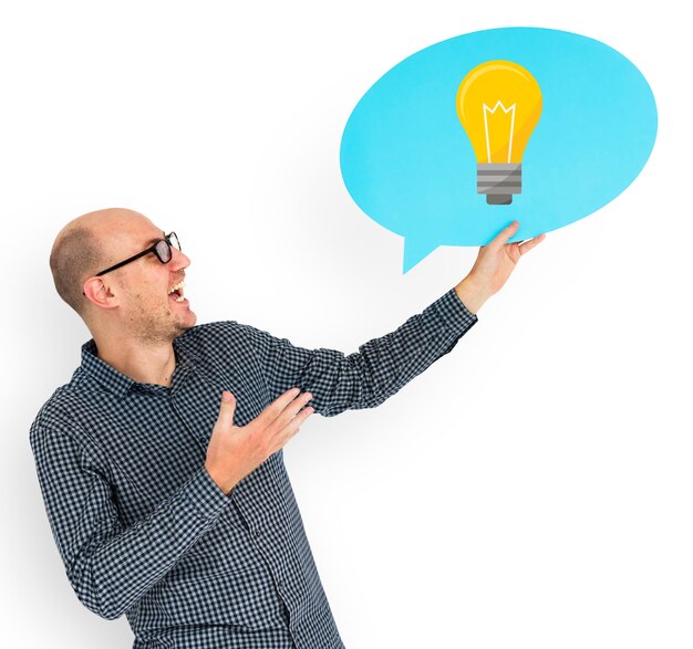 Happy man holding light bulb symbol