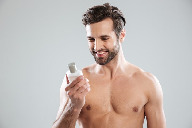 Happy man holding toilet water