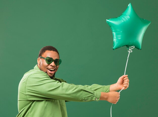 Happy man at party wearing sunglasses