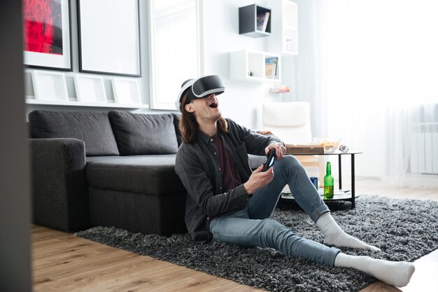 Happy man play games with 3d virtual reality glasses