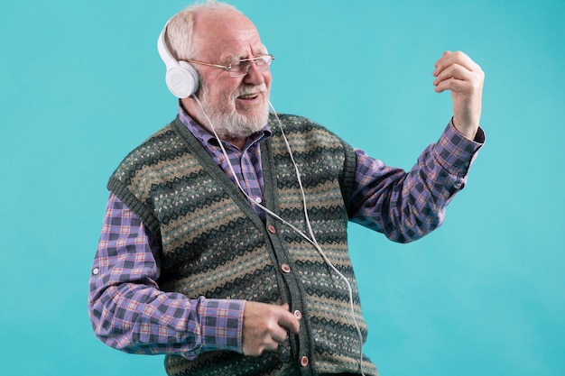 Happy man playing imaginary guitar