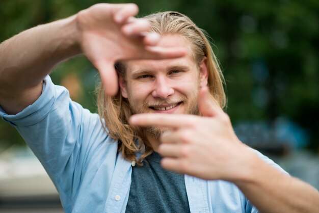 Happy man posing outdoors