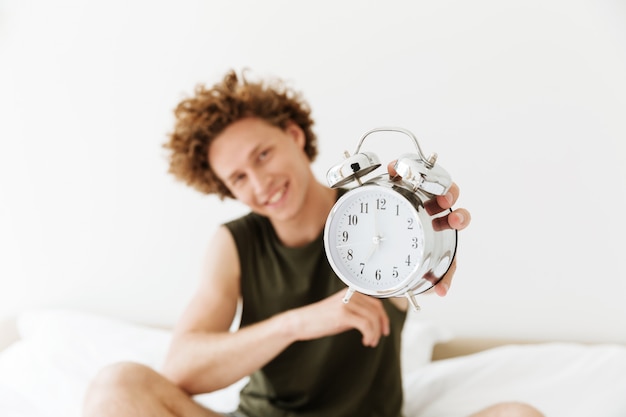 Free photo happy man showing alarm