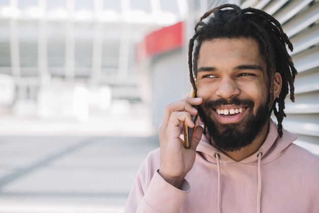 Happy man talking on phone