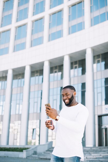 Happy man using smartphone