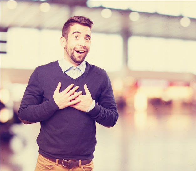 Happy man with hands on chest