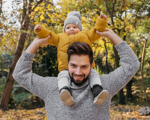 Happy man with his child outside