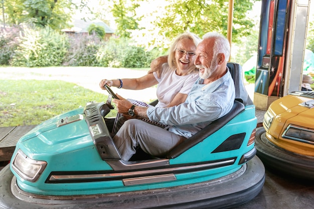 Free photo happy man and woman driving a car