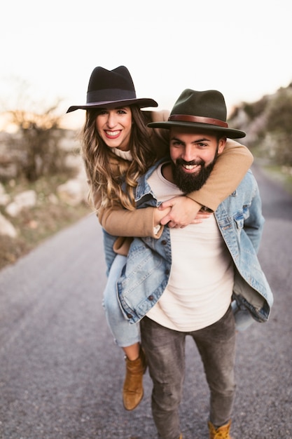 Happy man and woman looking at photographer