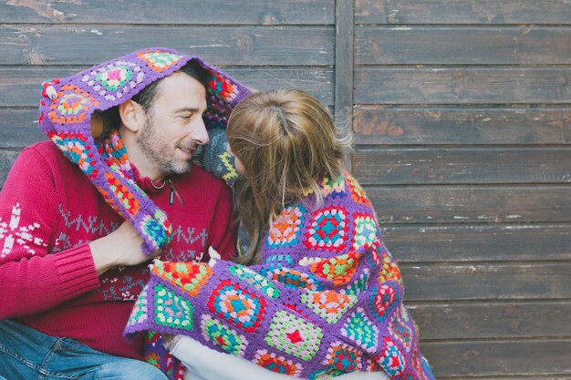 Happy man and woman in plaid