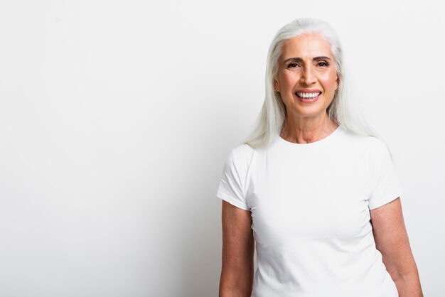 Happy mature woman smiling at camera