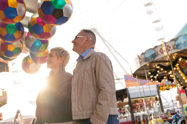 Happy middle age couple having a date outdoors