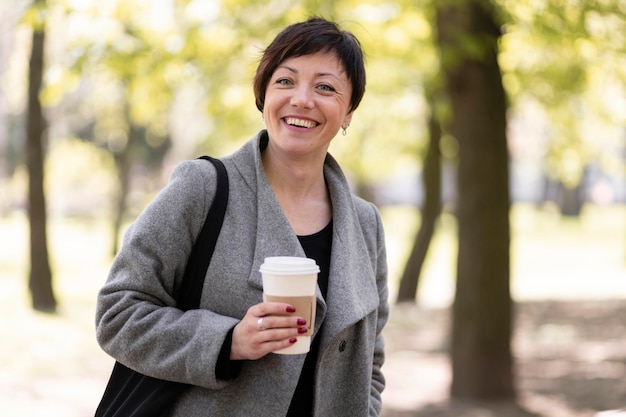 Happy middle aged woman walking