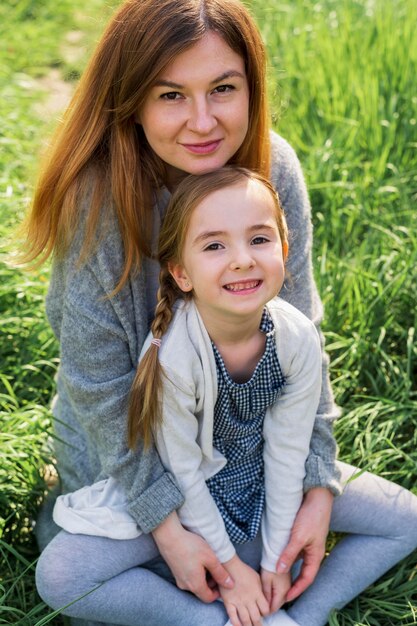 Happy mom and daughter outdoors