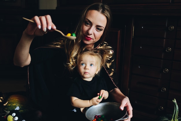 Happy mother playing with her daughter