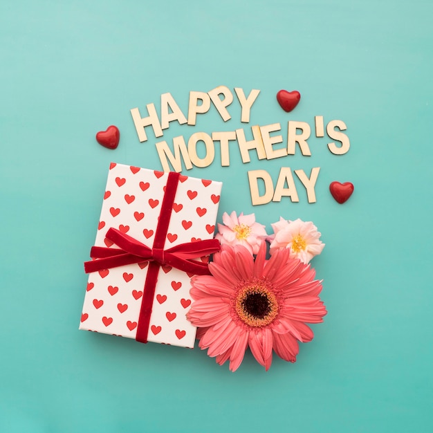 "happy mother's day" lettering, gift box, hearts and flowers