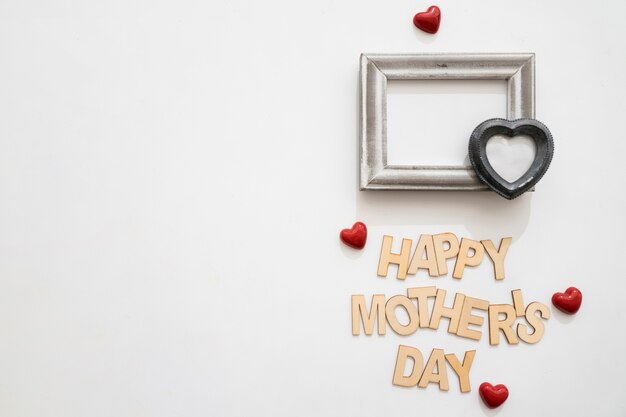 Happy mother's day lettering with black heart on frame