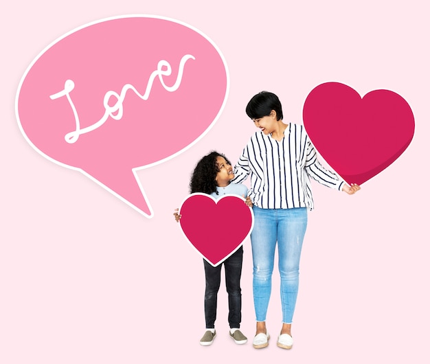 Happy mother and son holding heart icons