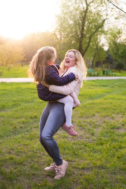 Happy mother with kid in nature