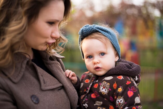 Happy mother with kid in nature