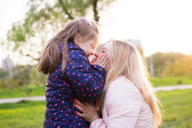 Happy mother with kid in nature