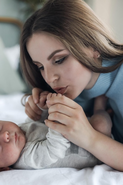 happy mother with newborn at home