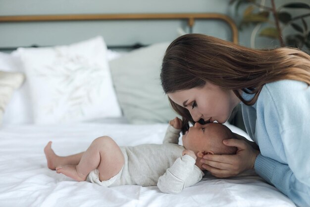 happy mother with newborn at home