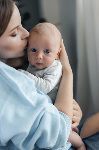 happy mother with newborn at home