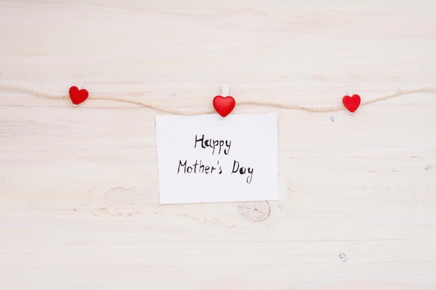 Happy Mothers Day inscription pinned to rope