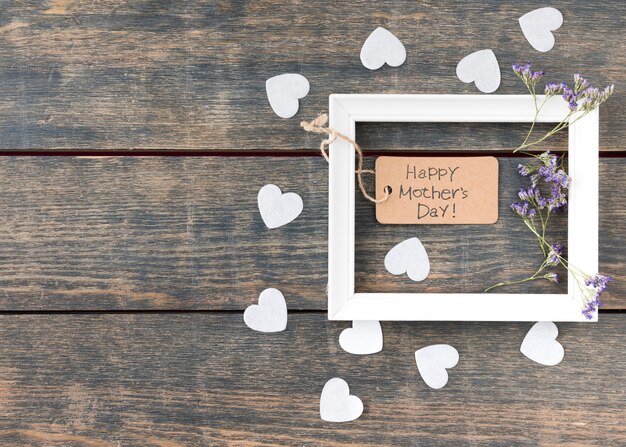 Happy Mothers Day inscription with flowers and small hearts 