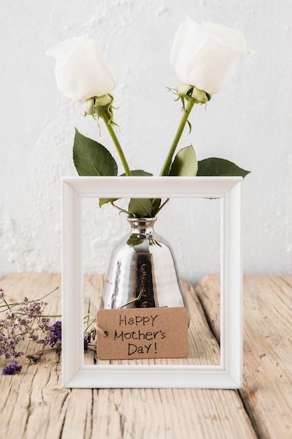 Happy Mothers Day inscription with roses in vase