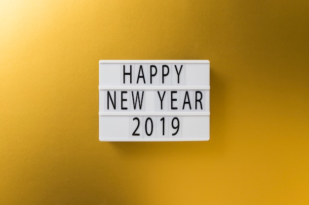 Happy New Year 2019 inscription on white board 