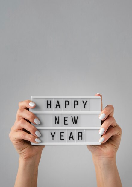 Happy new year card being held in hands with copy space