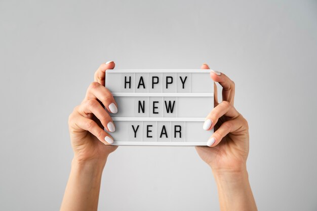 Happy new year card being held in hands