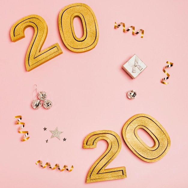 Happy new year with numbers 2020 on pink background