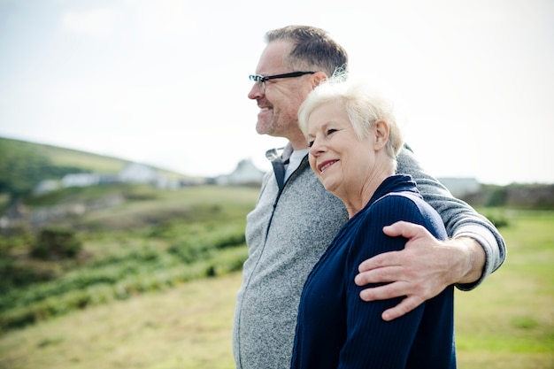 Free photo happy old couple standing together