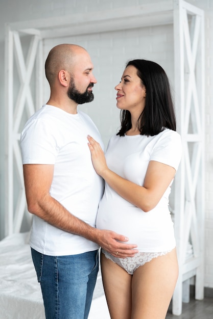 Happy parents looking at each other