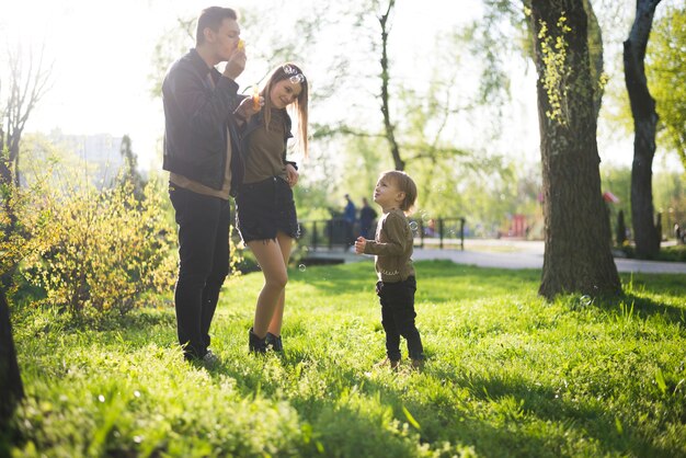 Happy parents with child in nature