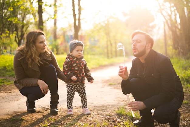 Happy parents with child in nature