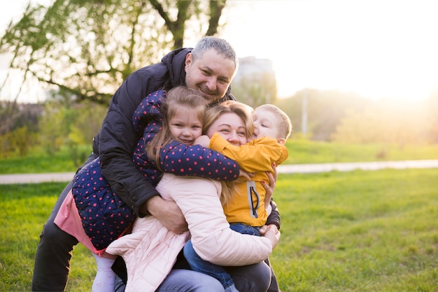 Happy parents with kids in nature