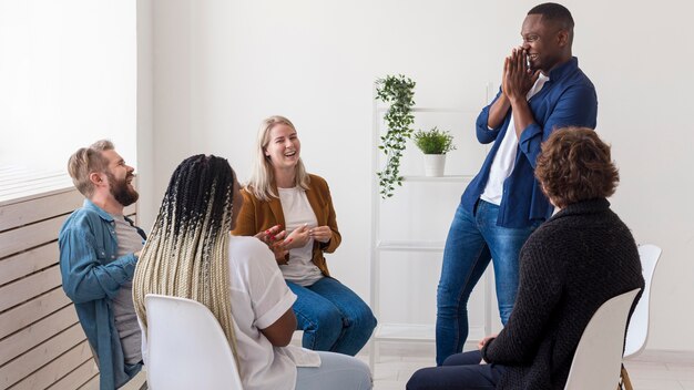 Happy people chatting at meeting