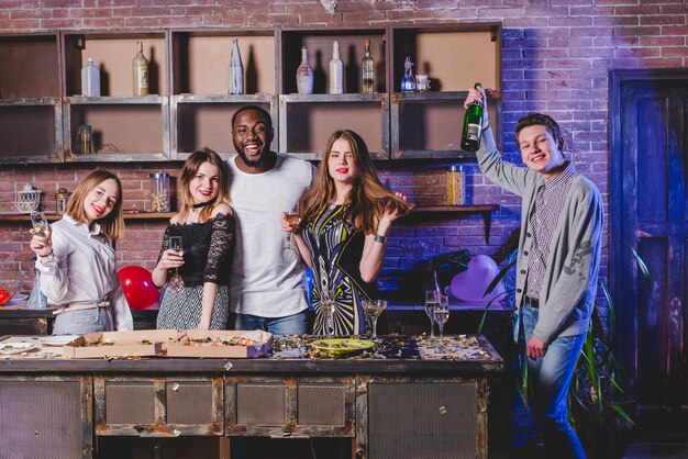 Happy people having party on kitchen