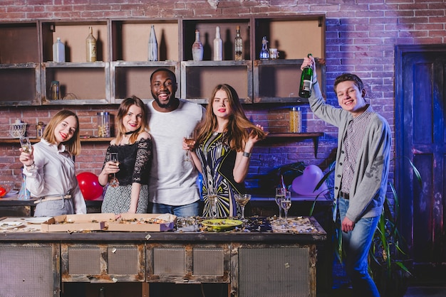 Happy people having party on kitchen