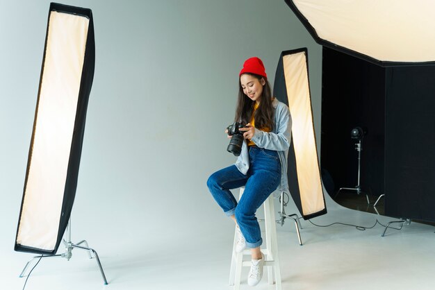 Happy photographer holding camera