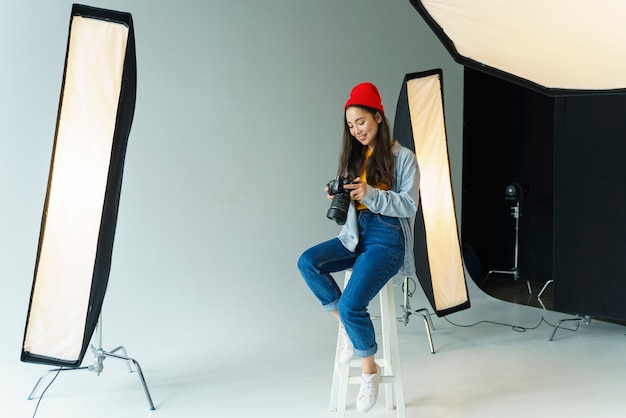 Happy photographer holding camera